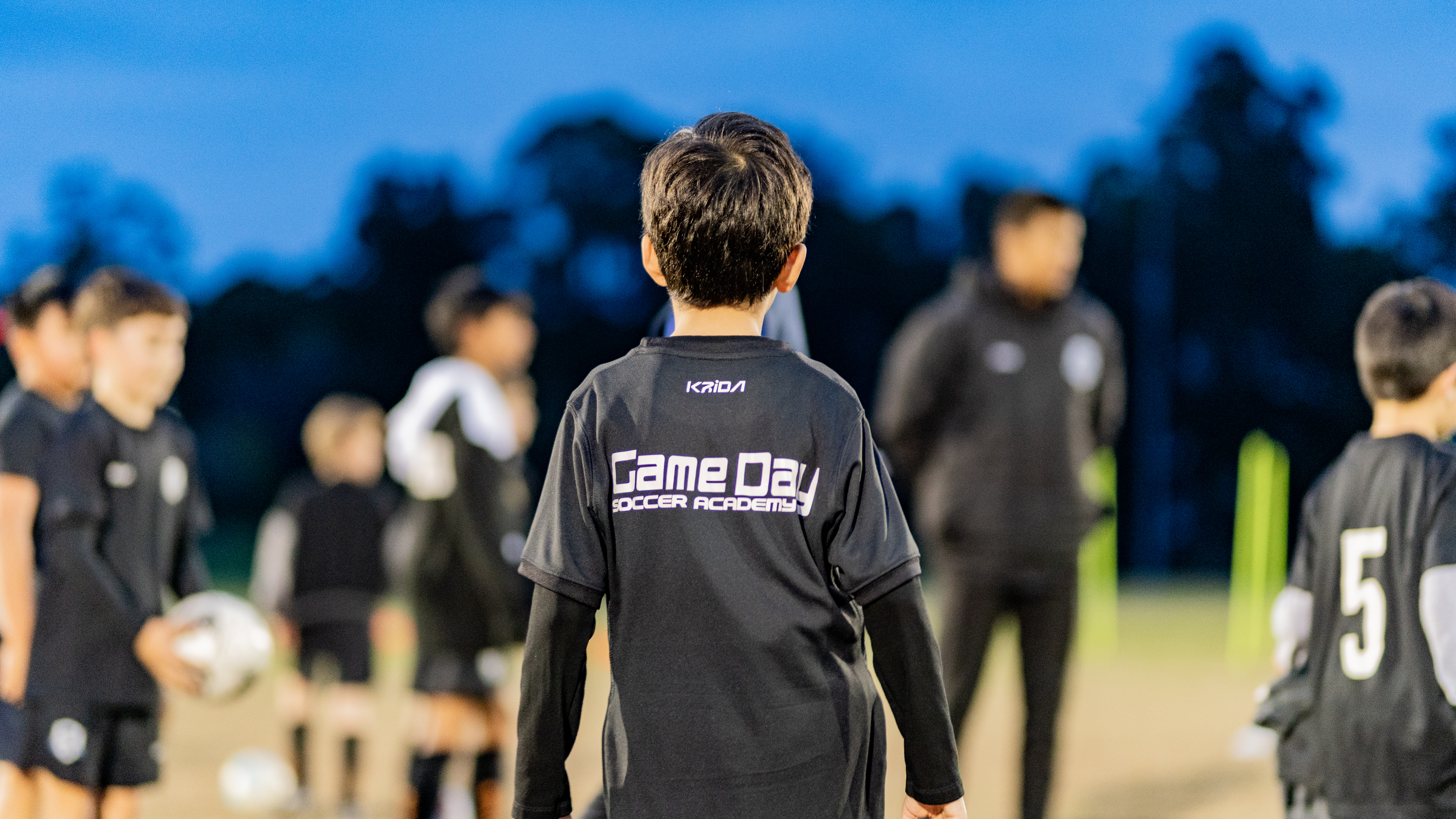 Game Day Soccer Academy players celebrating a goal