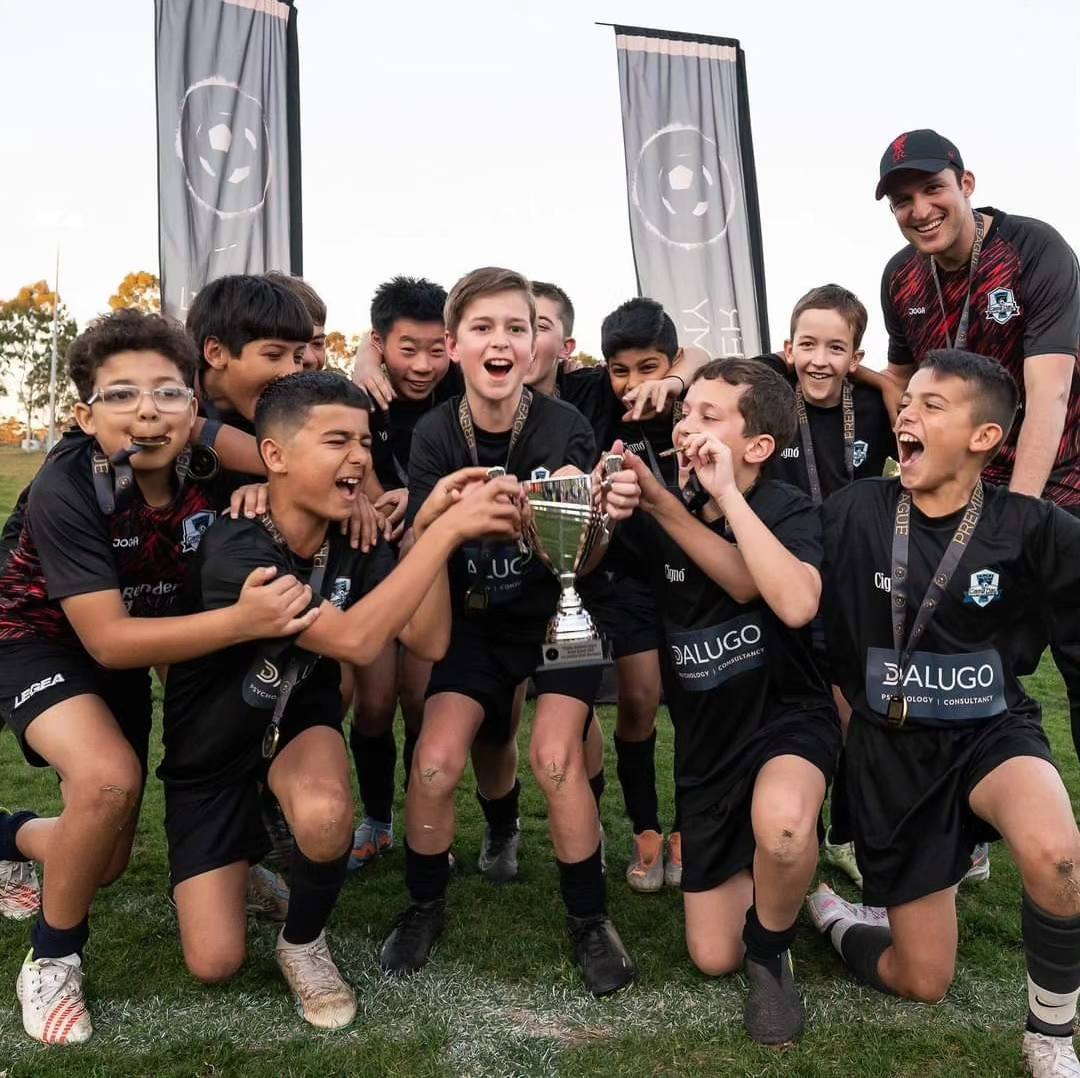 Game Day Soccer Academy players in training huddle